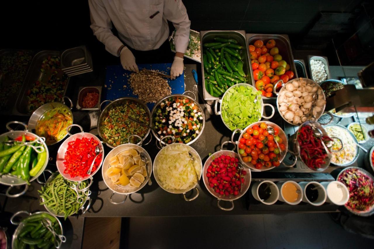 Cramim By Isrotel Exclusive Kiryat Anavim Exterior foto A chef preparing ingredients for a meal